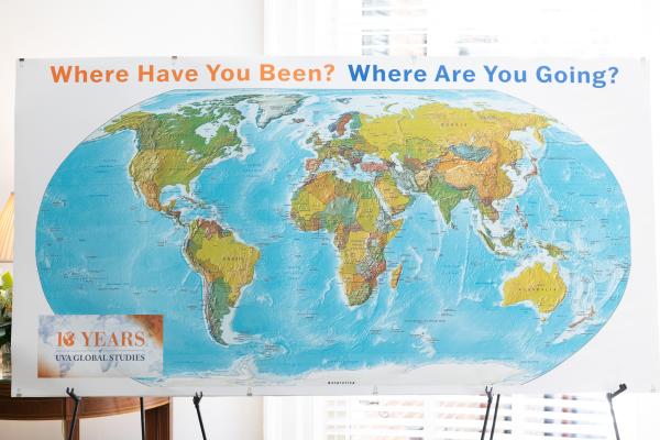 A board with "Where have you been? Where are you going?" over a painted globe. In the corner there is a logo that reads 10 years of global studies.